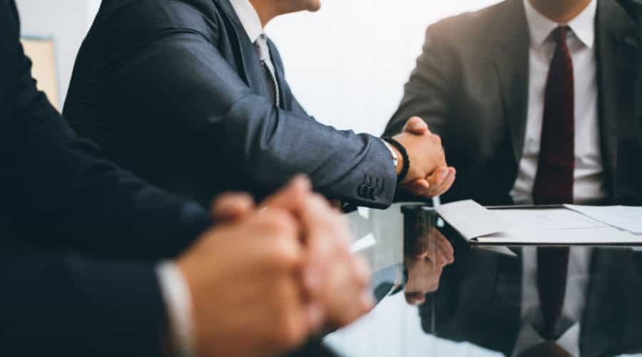 Business handshake between lawyer and client.