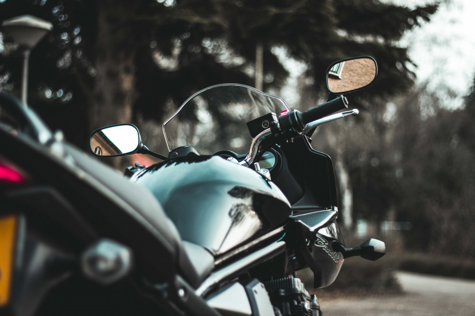 Parked motorcycle on street.